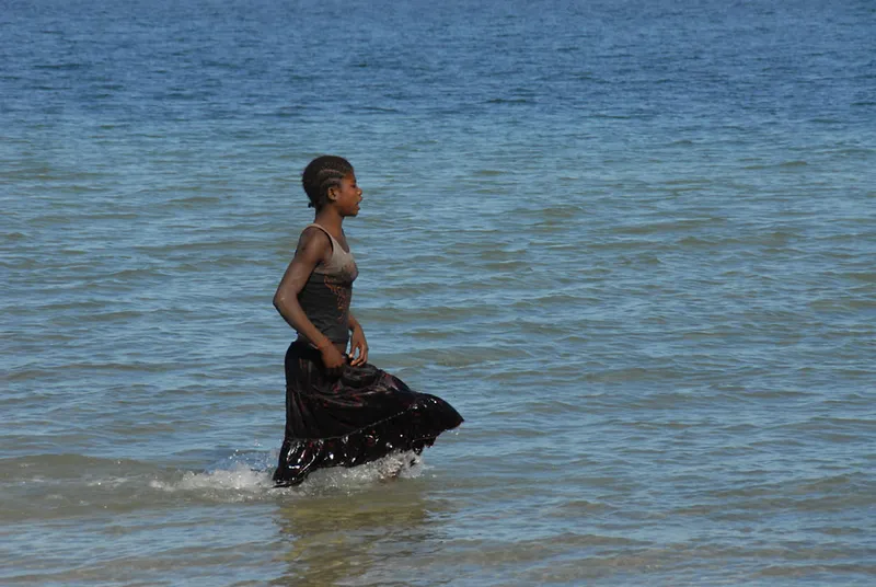 Young lady in dress in the sea