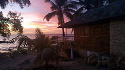 Bungalow of the Bella Donna hotel at sunset